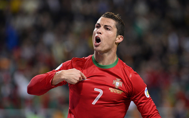 Portugal's forward Cristiano Ronaldo celebrates after scoring the second goal for Portugal during the FIFA 2014 World Cup playoff football match Sweden vs Portugal at the Friends Arena in Solna near Stockholm on November 19, 2013